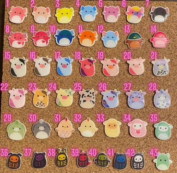 An Enamel Pin on A Squishmallow
