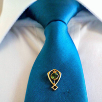 //iororwxhmqprli5p.ldycdn.com/cloud/lrBppKpmlmSRilrljlmqjm/How-To-Wear-A-Lapel-Pin-on-A-Tie.jpg